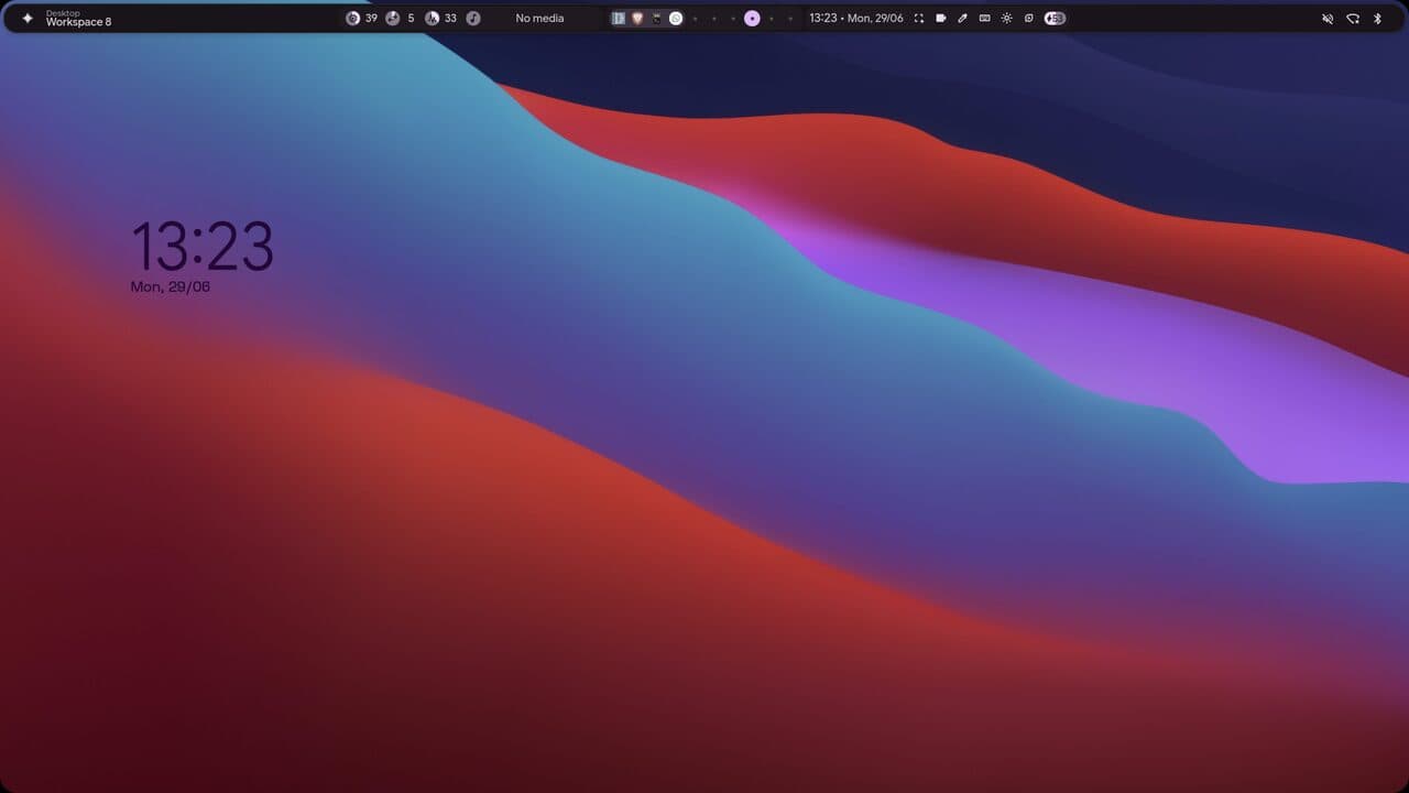 illogical-impulse Hyprland rice – top bar with a large clock widget.